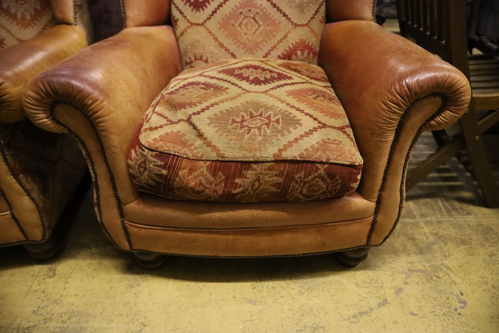 A pair of Tetrad style leather and kelim fabric upholstered wing club armchairs